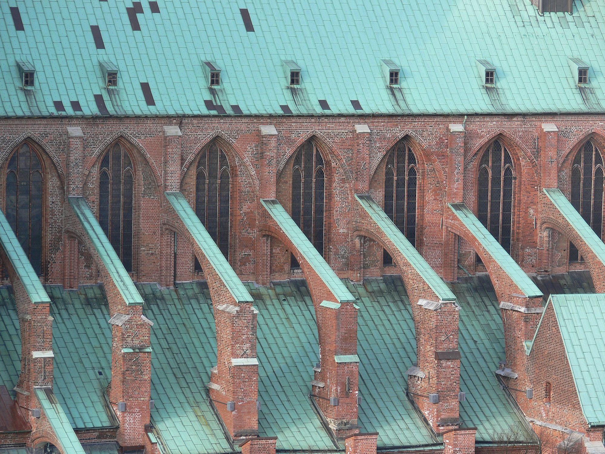 A flying buttress is a pillar that stands some distance from a wall. It is connected to the wall by a downward slanting beam or structure.